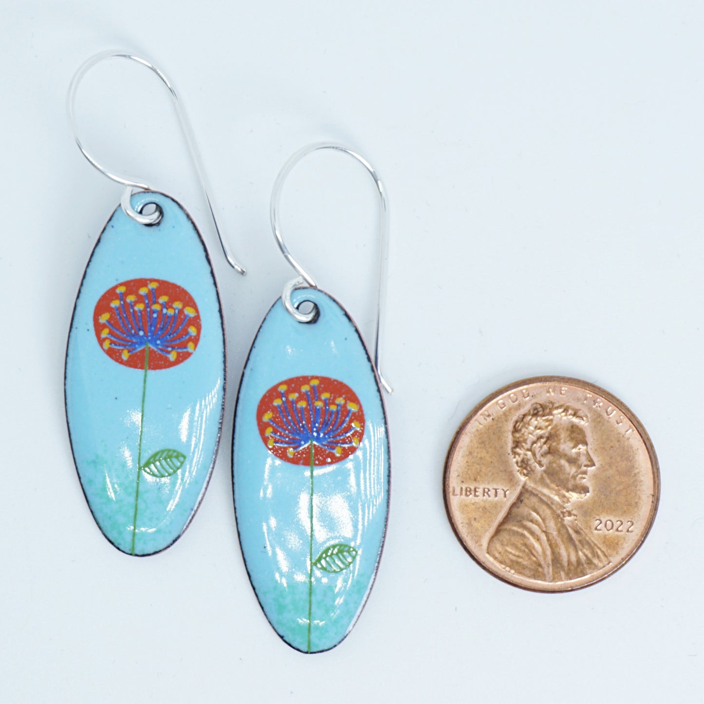CLEARANCE Red and Blue Dandelions on Light Blue Oval Earrings