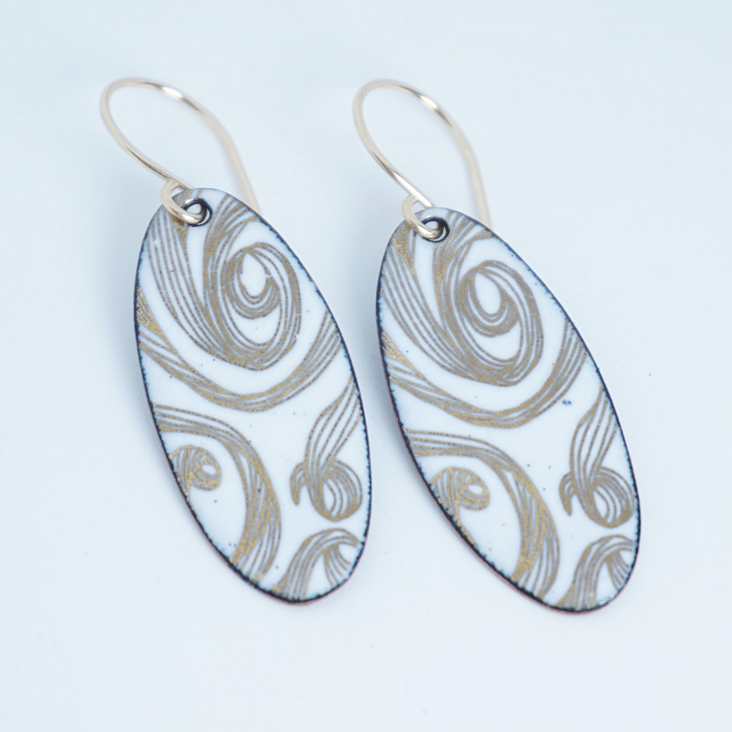 Gold Swirl on White Enamel Oval Earrings