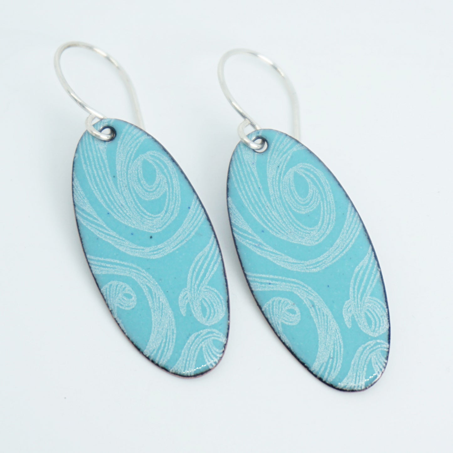 White Swirls on Light Teal Green Enamel Oval Earrings