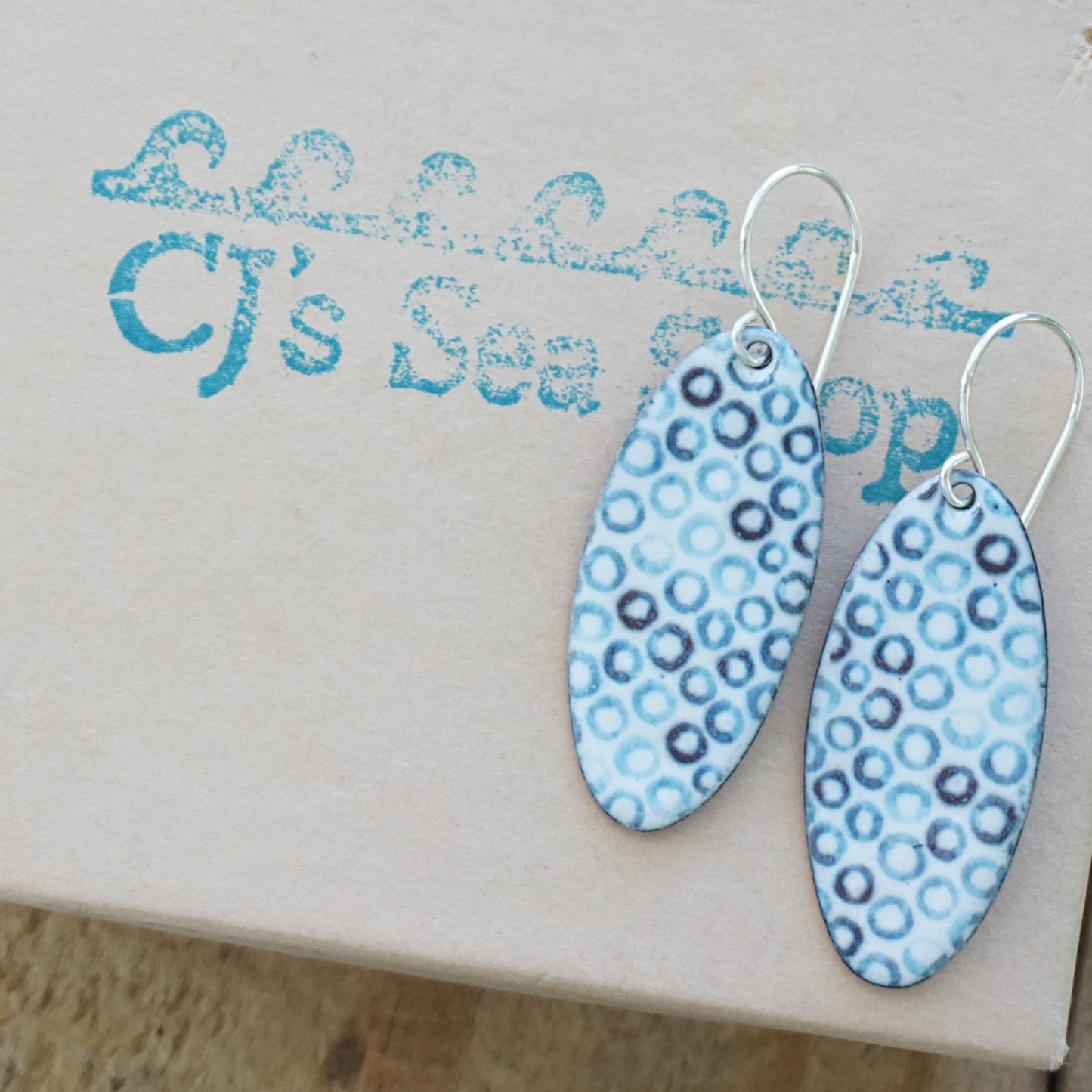 White Enamel Oval Earrings with Blue Bubbles