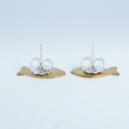 side view of a Pair of earrings with gold fish-shaped bases on a white background