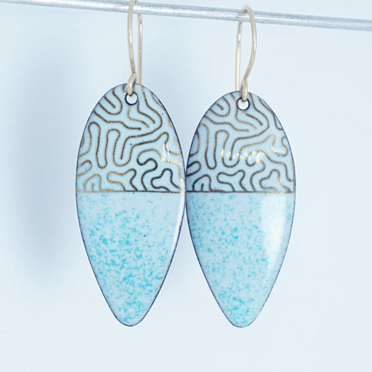 gold pattern on seafoam green enamel teardrop shaped earrings, on a white background