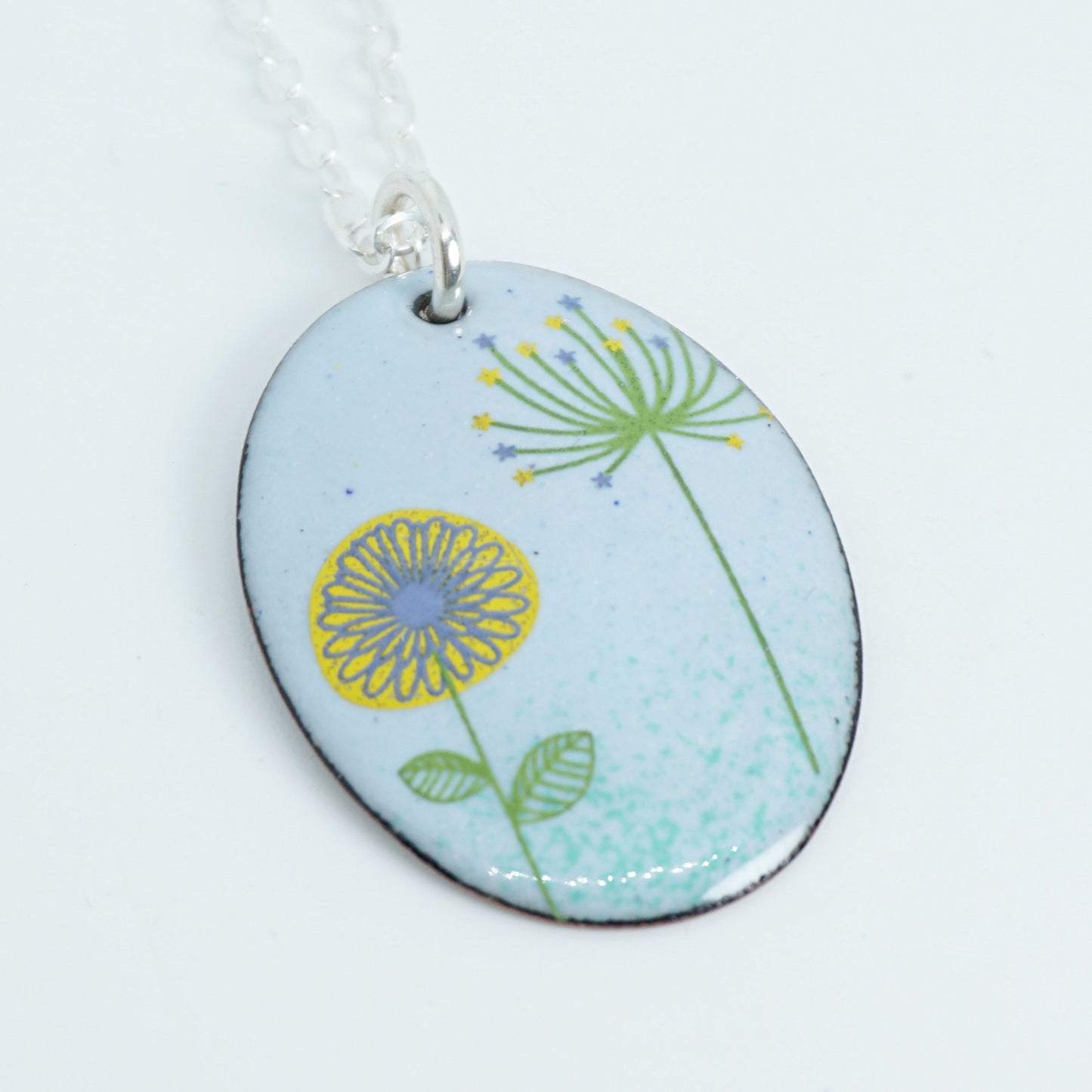 Yellow Daisy and Green Dandelion on Light Blue Enamel Oval Pendant