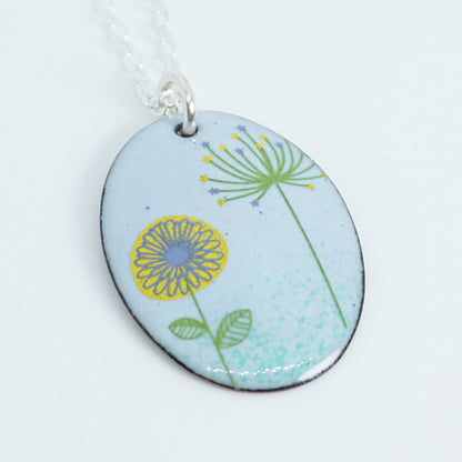 Yellow Daisy and Green Dandelion on Light Blue Enamel Oval Pendant