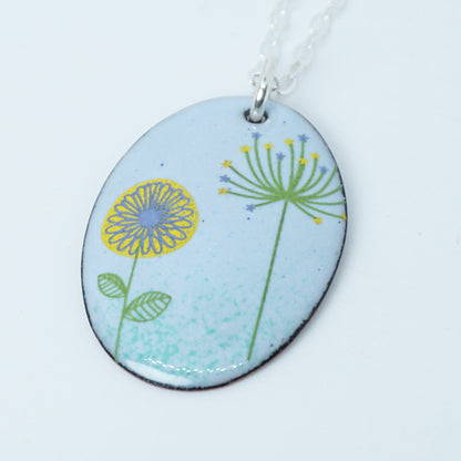 Yellow Daisy and Green Dandelion on Light Blue Enamel Oval Pendant