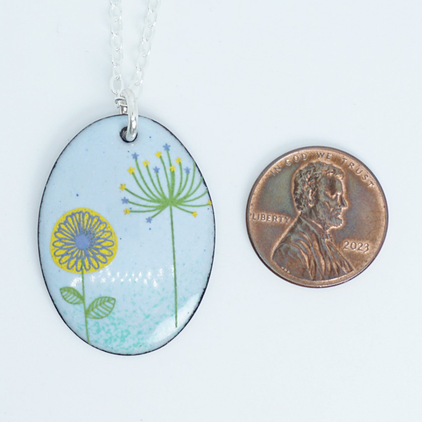 Yellow Daisy and Green Dandelion on Light Blue Enamel Oval Pendant