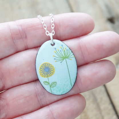 Yellow Daisy and Green Dandelion on Light Blue Enamel Oval Pendant