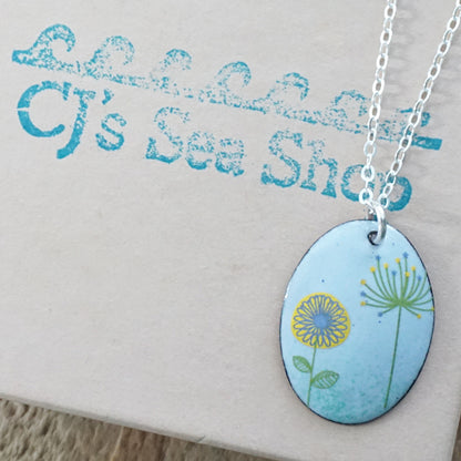 Yellow Daisy and Green Dandelion on Light Blue Enamel Oval Pendant