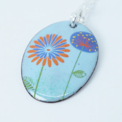 Red Daisy and Purple Dandelion on Light Blue Enamel Oval Pendant