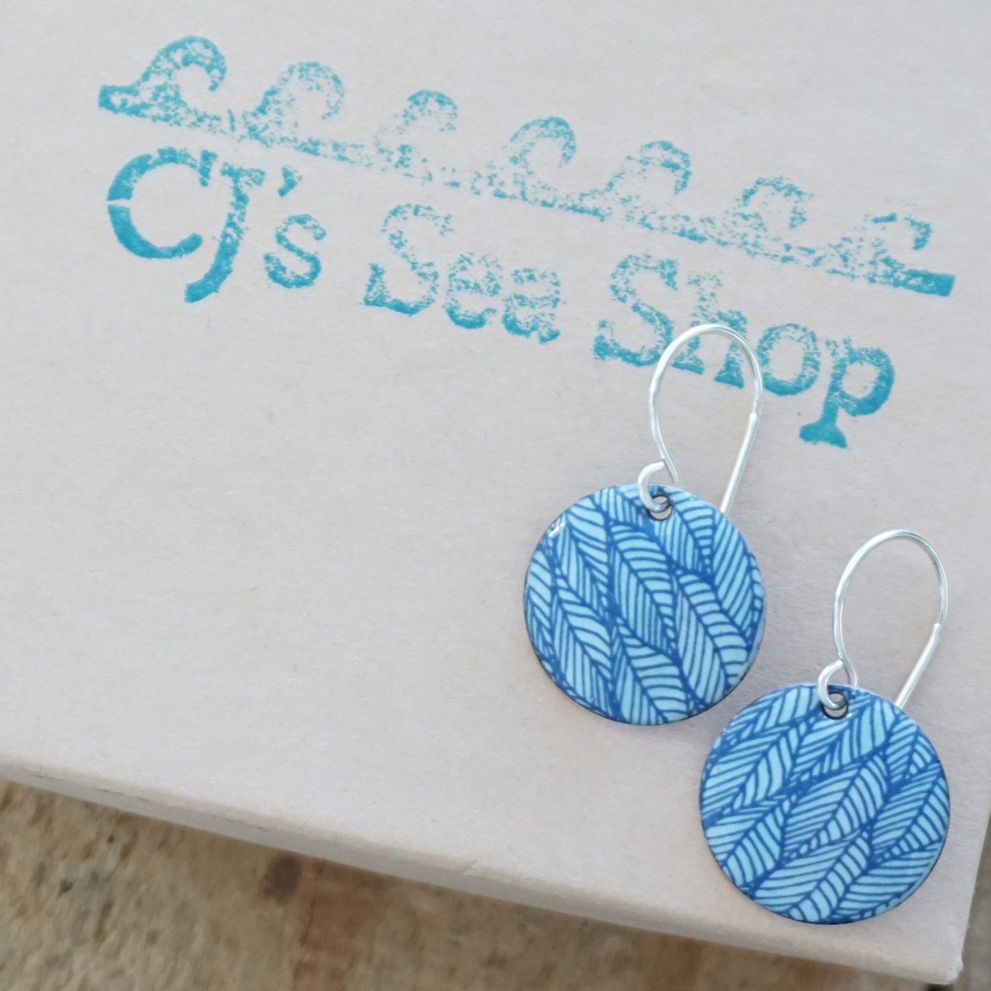 Blue Leaf Accents on Light Blue Enamel Disc Earrings