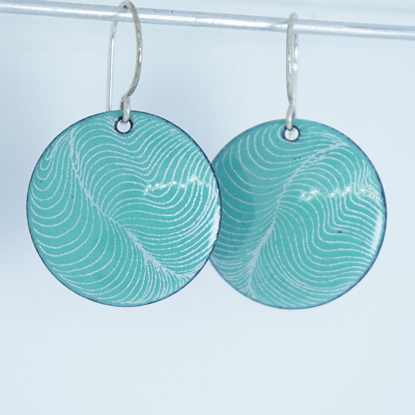 White Feather Accents on Green Enamel Disc Earrings