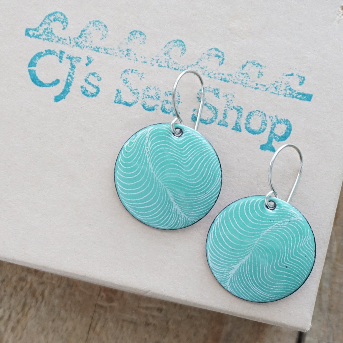 White Feather Accents on Green Enamel Disc Earrings