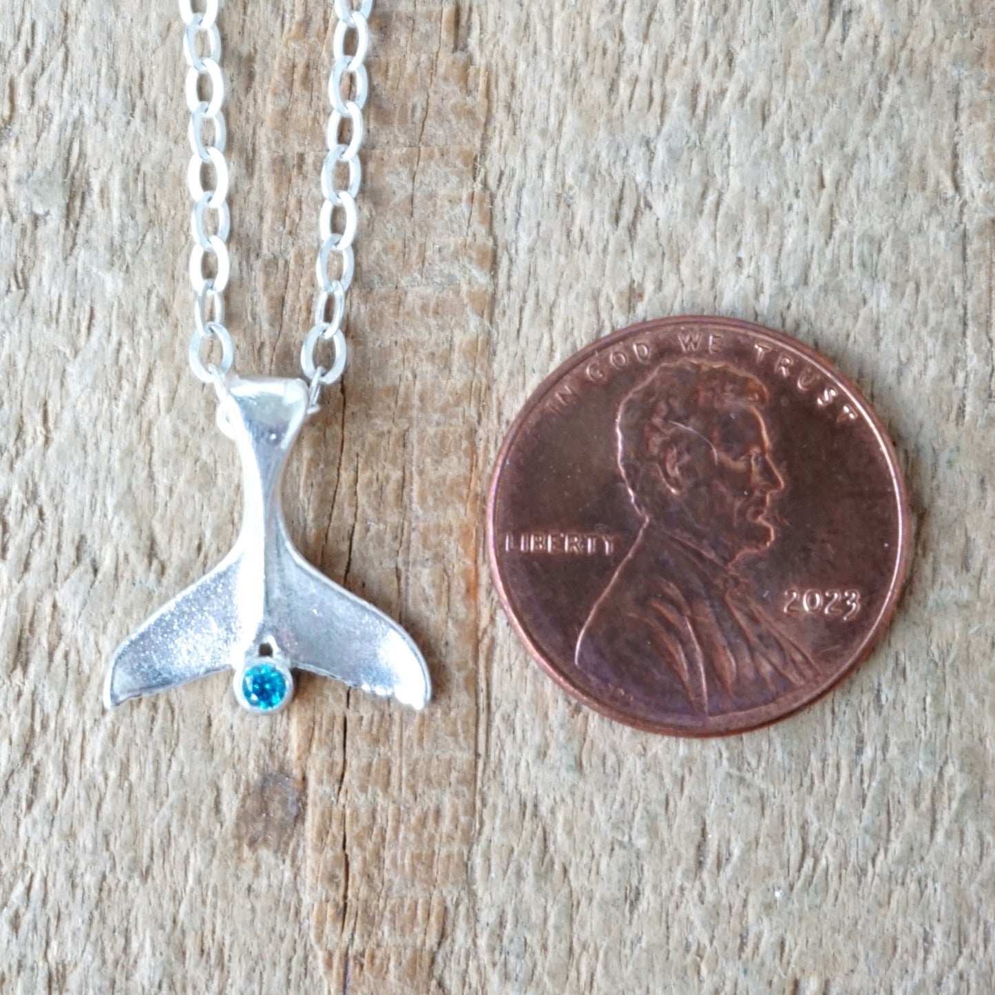 Sterling Silver Mermaid/Whale Tail and Aqua Blue Cubic Zirconia Pendant
