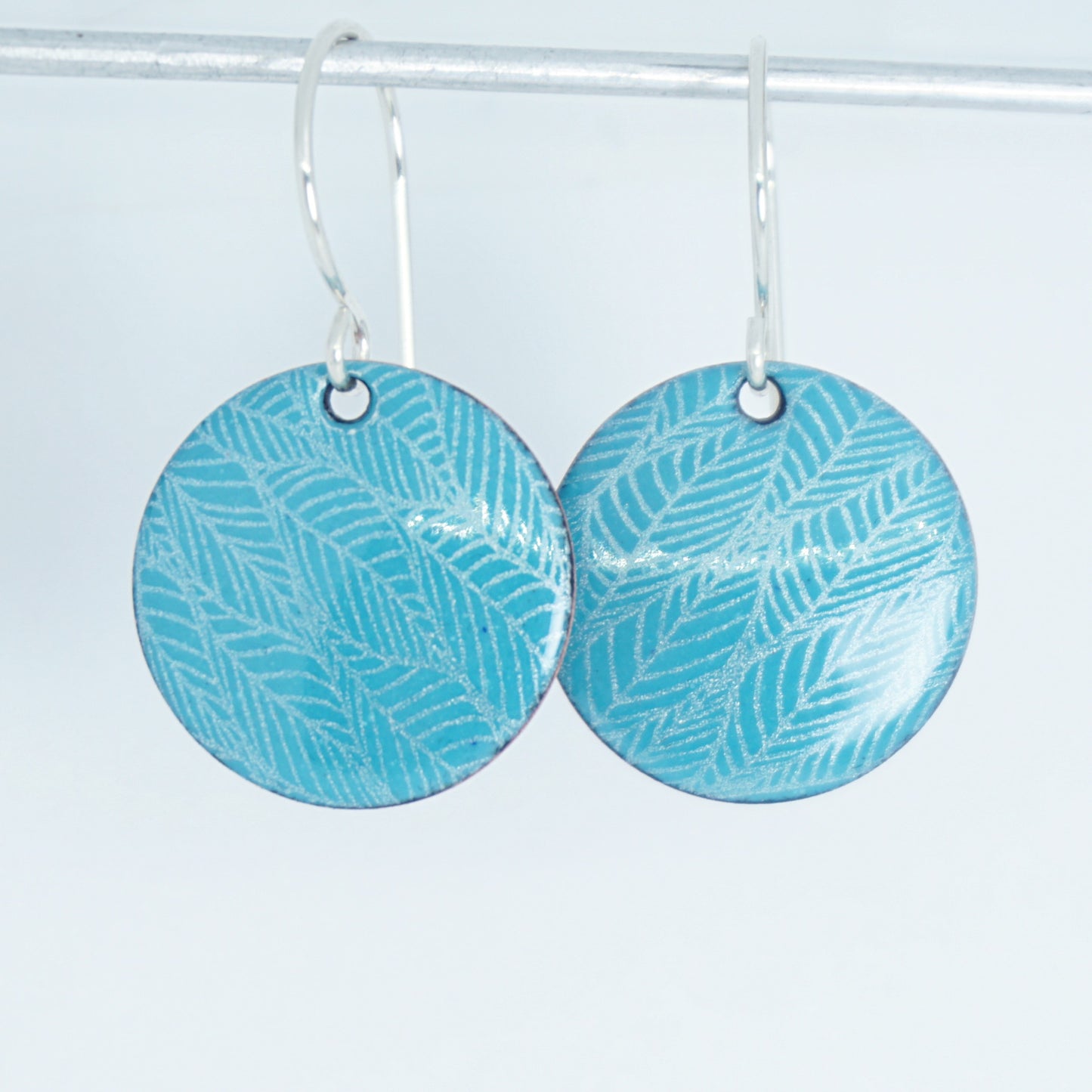 Teal Green Enamel Disc Earrings with White Leaf Accents
