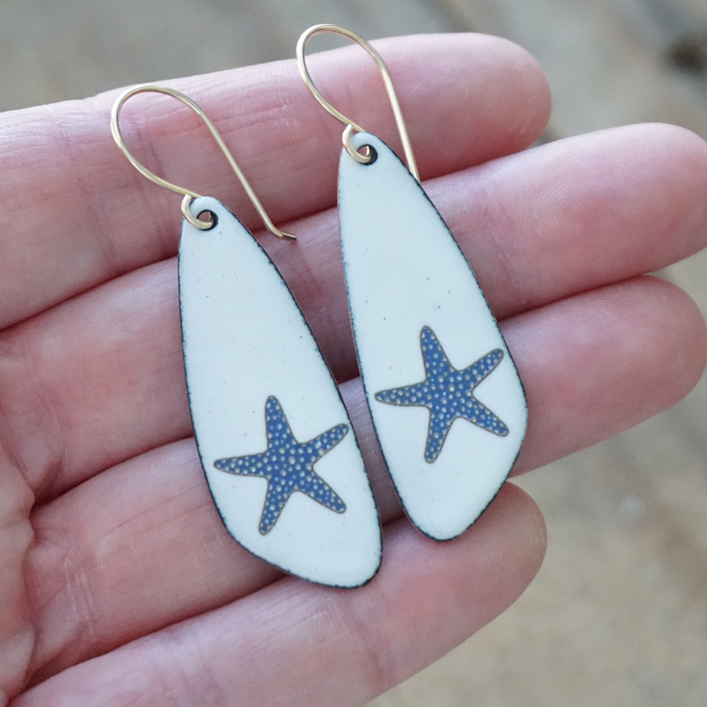 White Enamel Teardrop Earrings with Blue and Gold Starfish