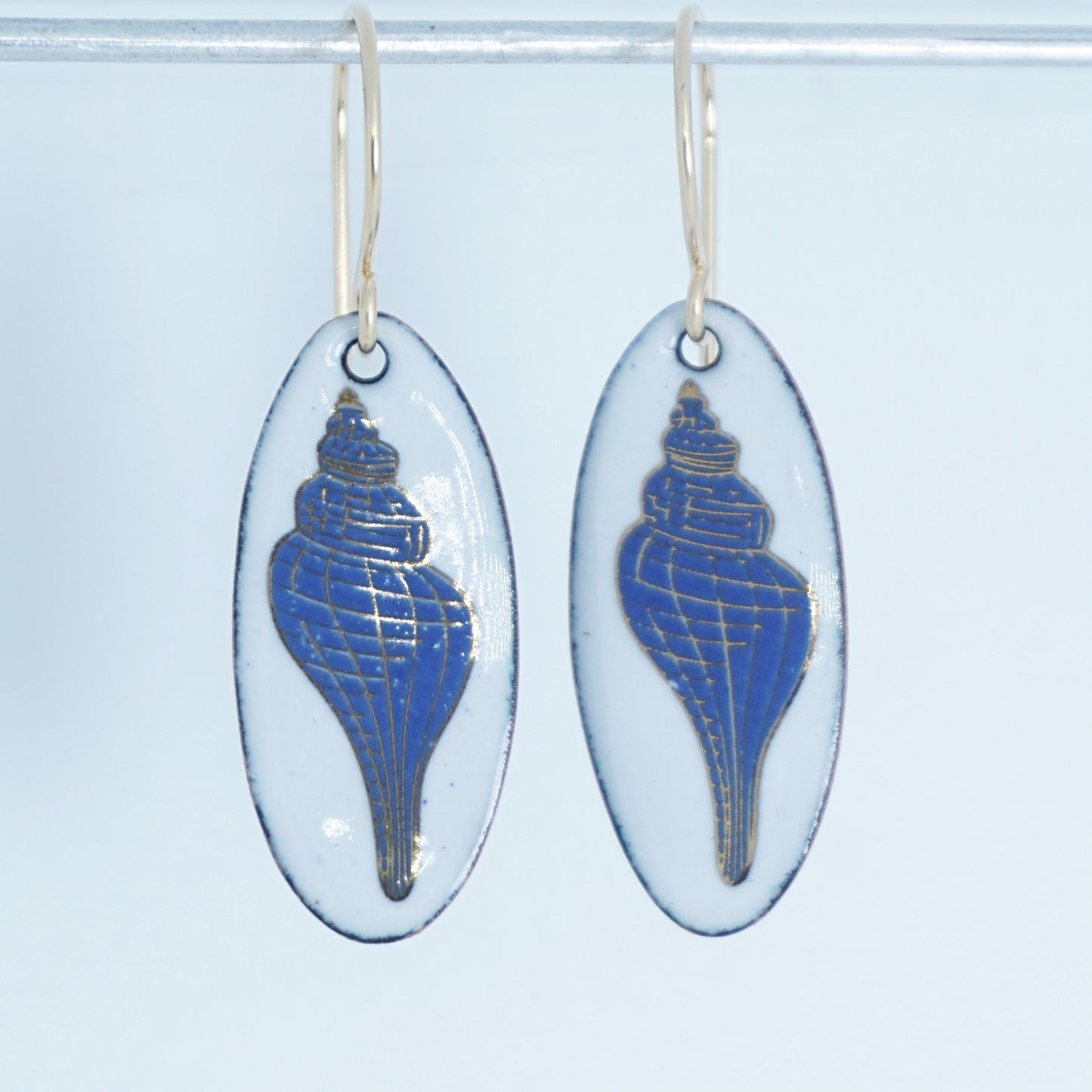 White Enamel Oval Earrings with Blue and Gold Conch Shell