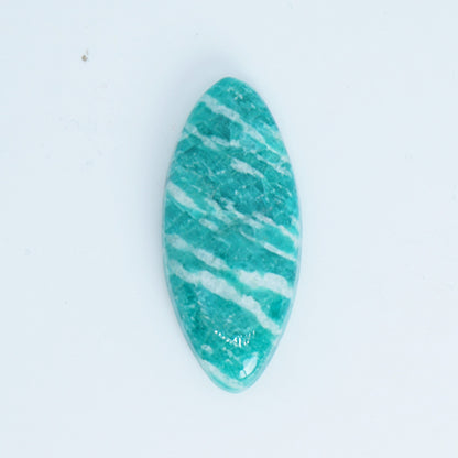 Teal and white marbled stone on a light blue background