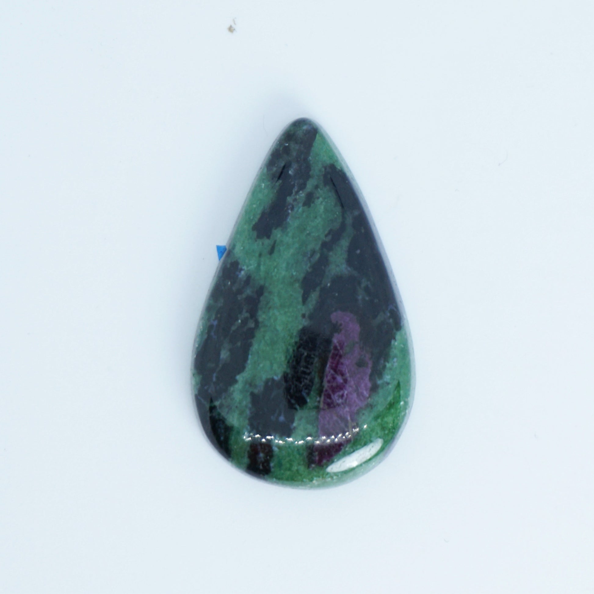 Teardrop-shaped gemstone with green and purple patterns on a white background