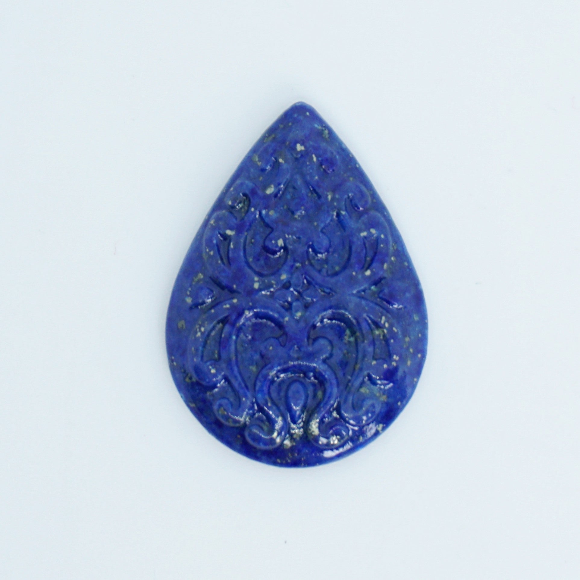 blue lapis cabochon with carved surface available for custom jewelry