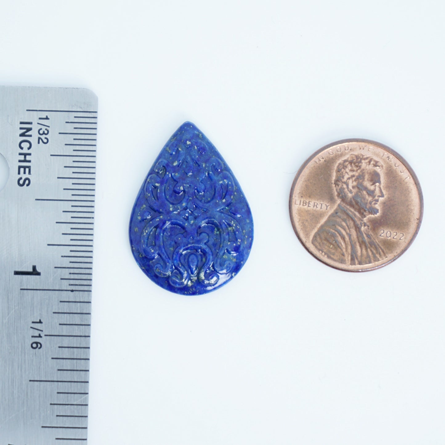 blue lapis cabochon with carved surface available for custom jewelry