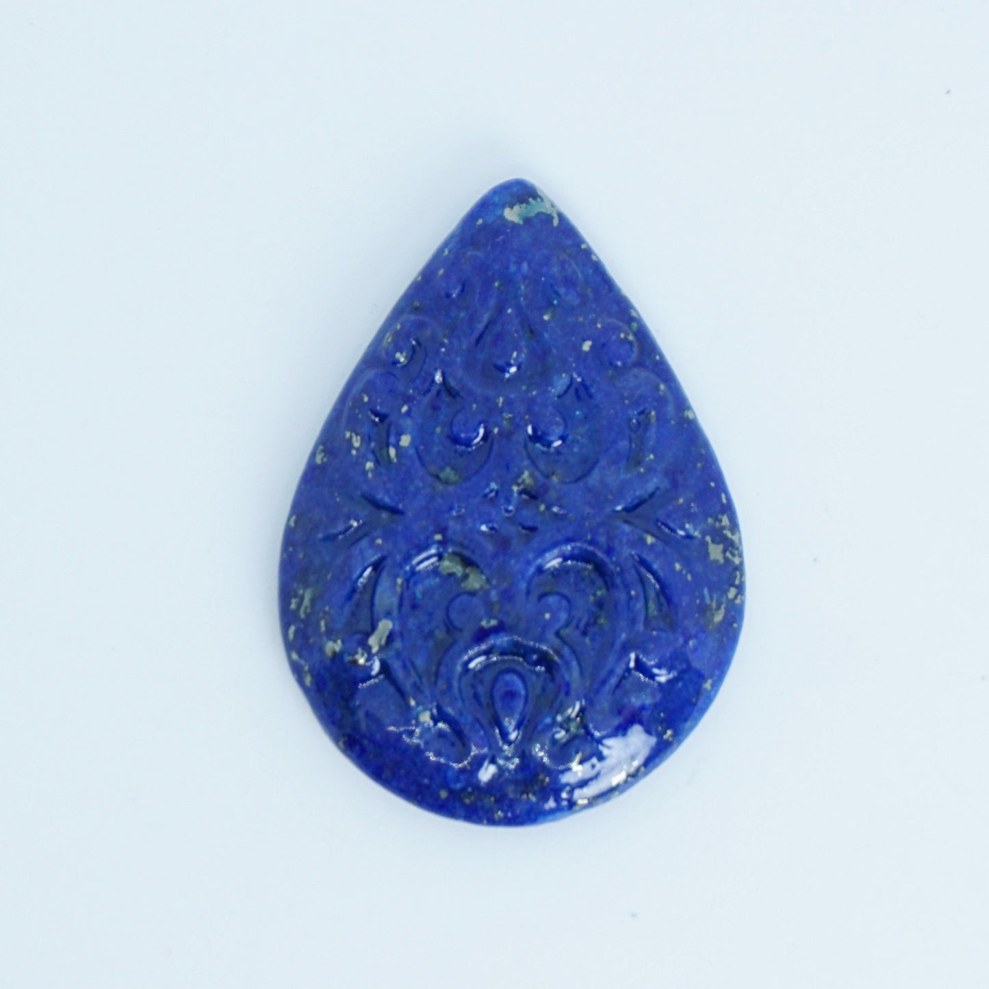 blue lapis cabochon with carved surface available for custom jewelry