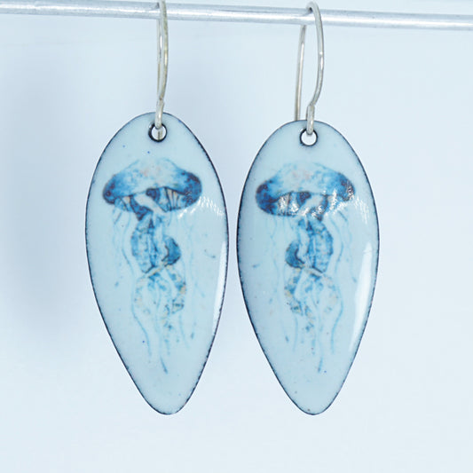 teardrop shaped earrings with jellyfish design on a white background