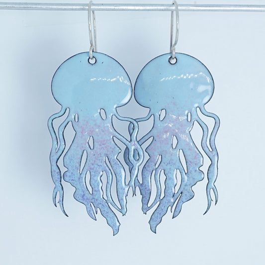 Jellyfish-shaped earrings with a blue and pink gradient on a white background