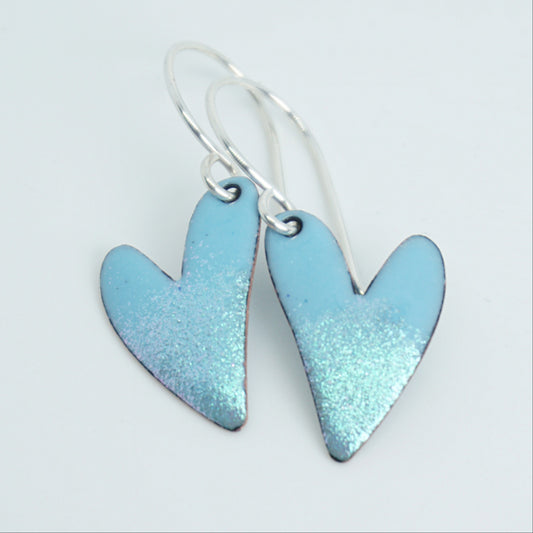 Heart-shaped earrings with a light blue finish on a white background