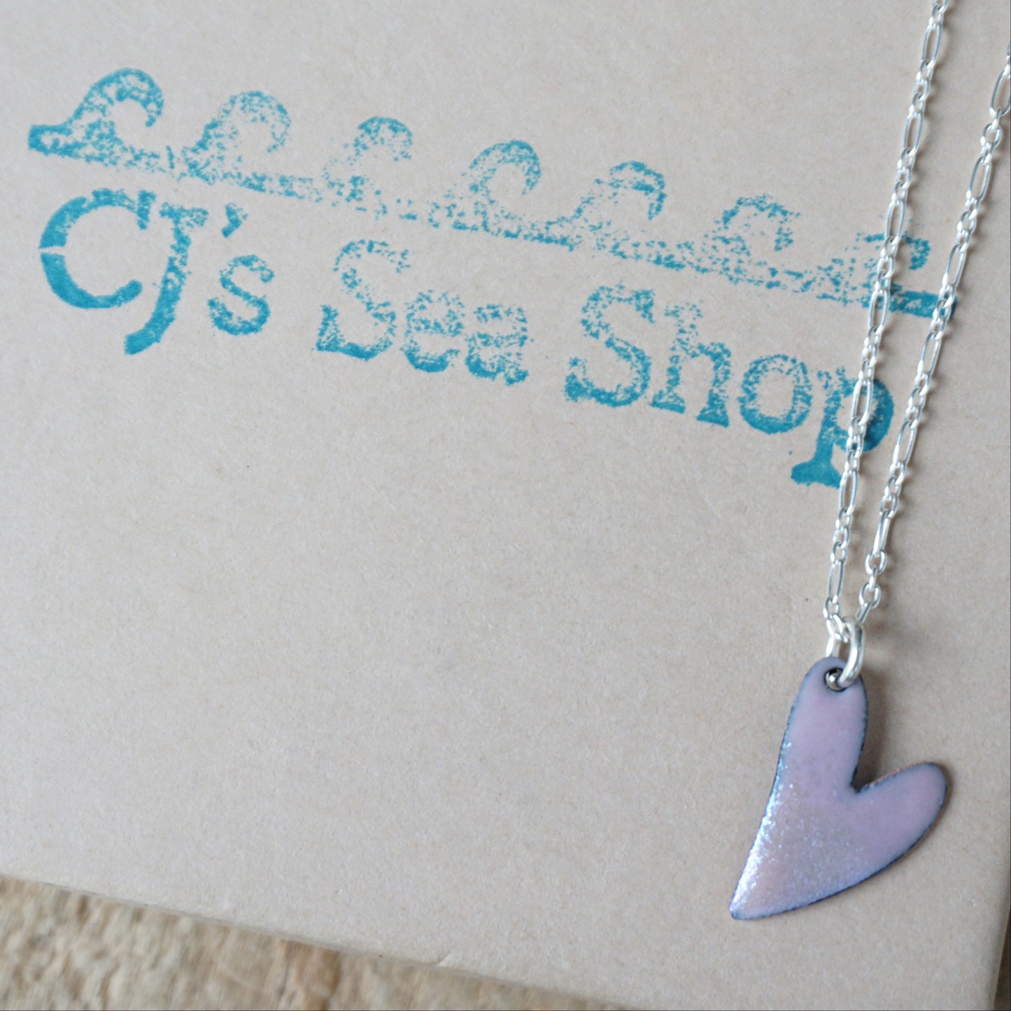 pink Heart-shaped pendant necklace on a gift box