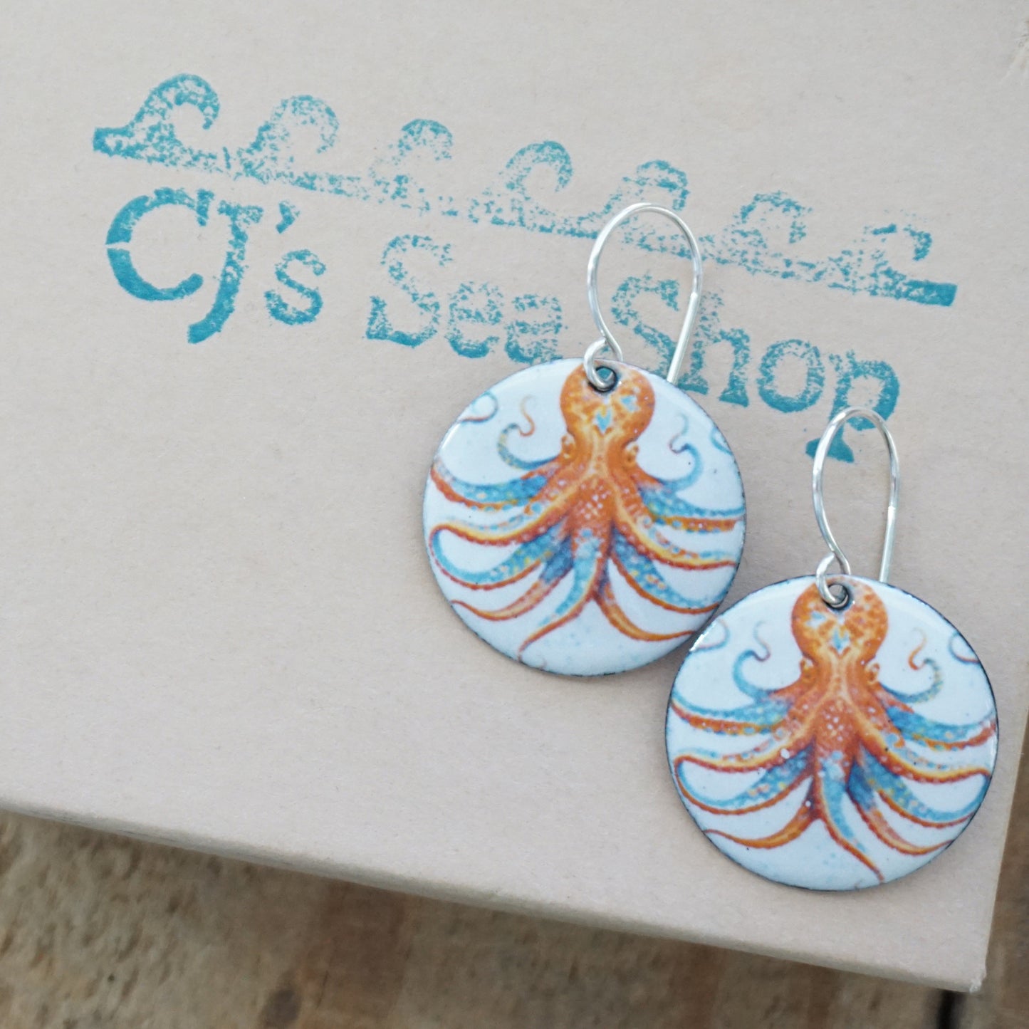 Pair of earrings with octopus design on a gift card