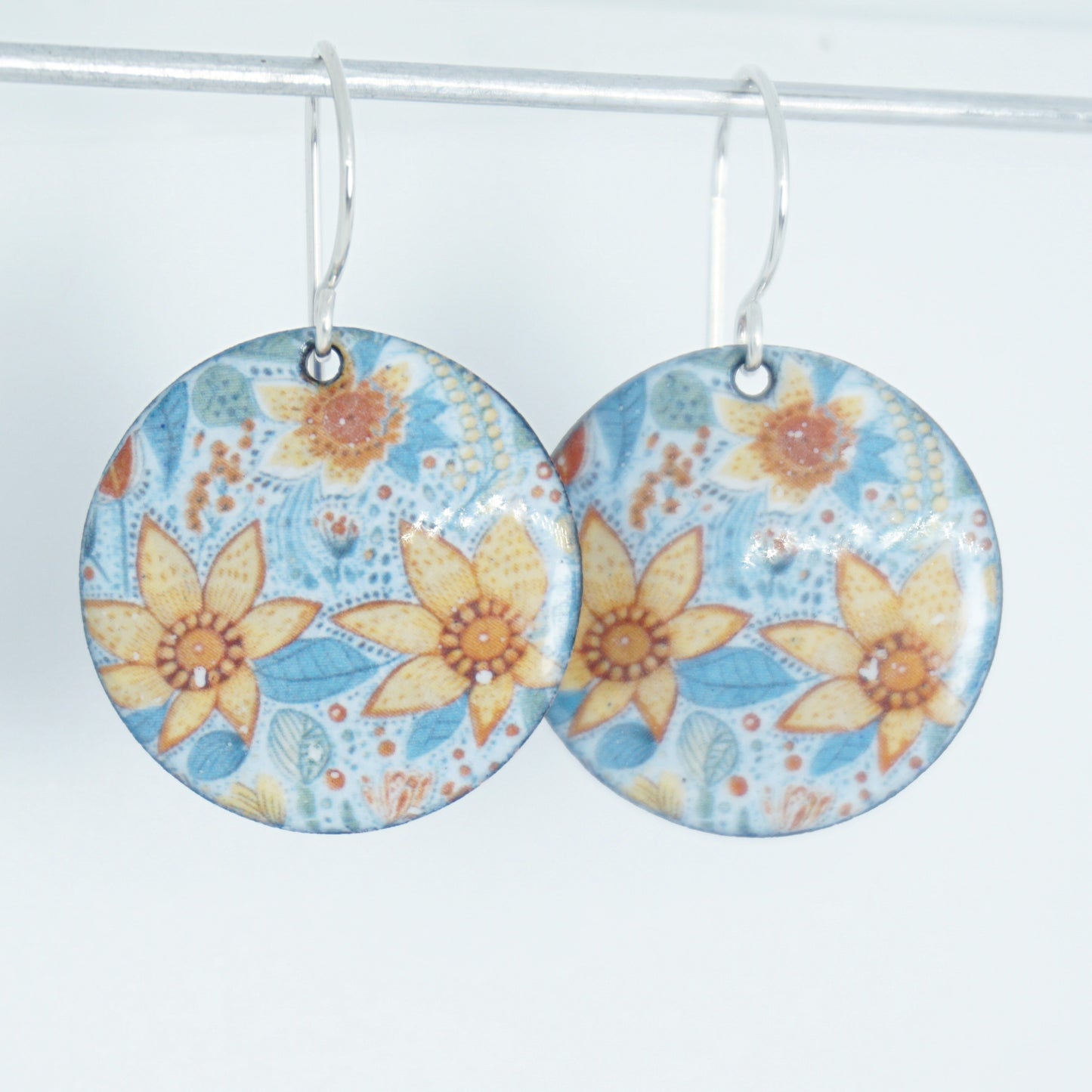 Floral patterned earrings on a white background