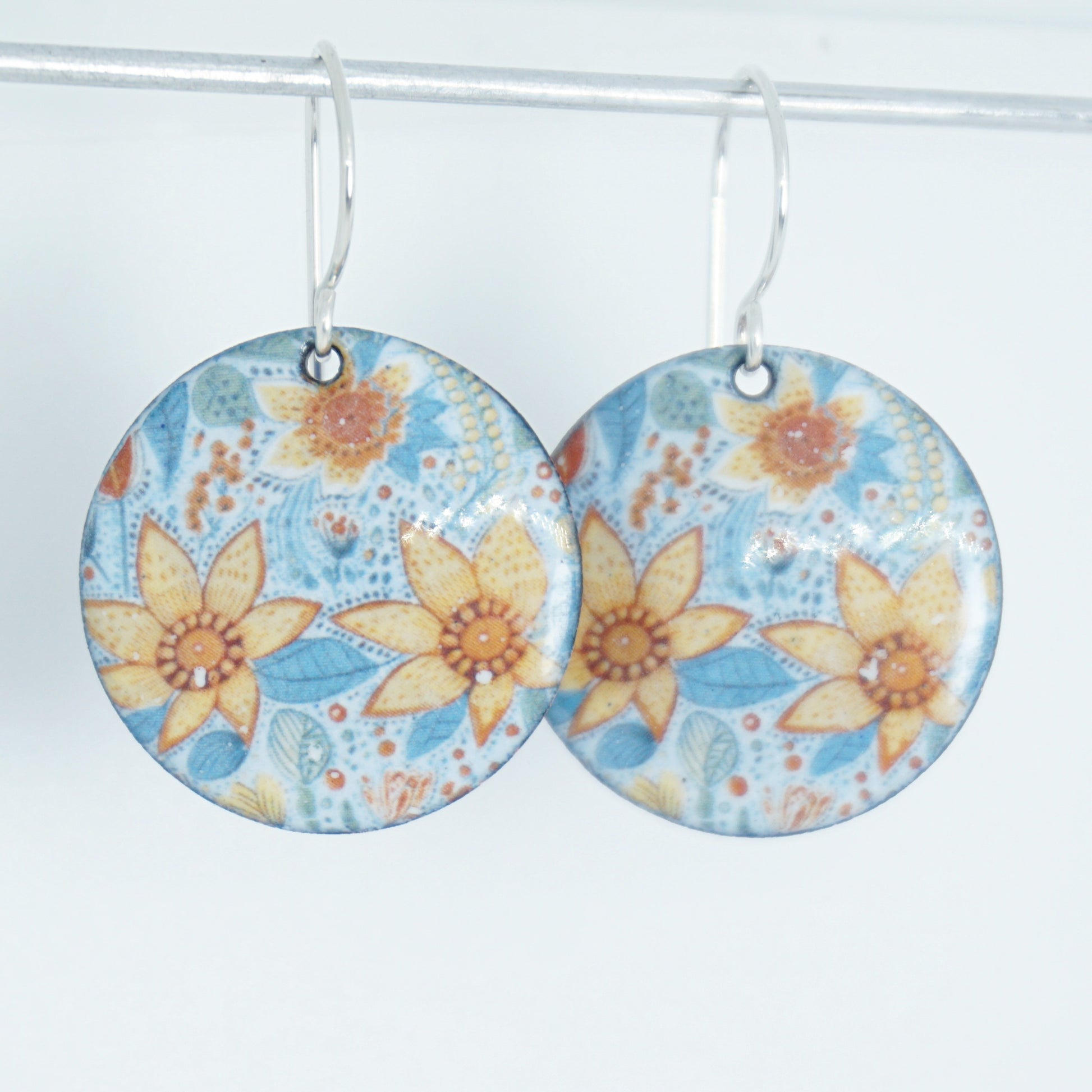 Floral patterned earrings on a white background