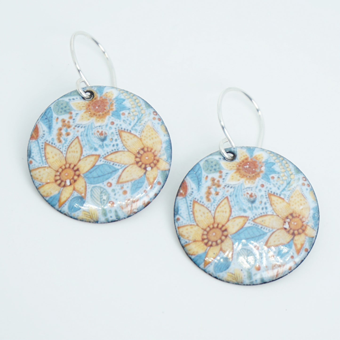 Floral patterned earrings on a white background