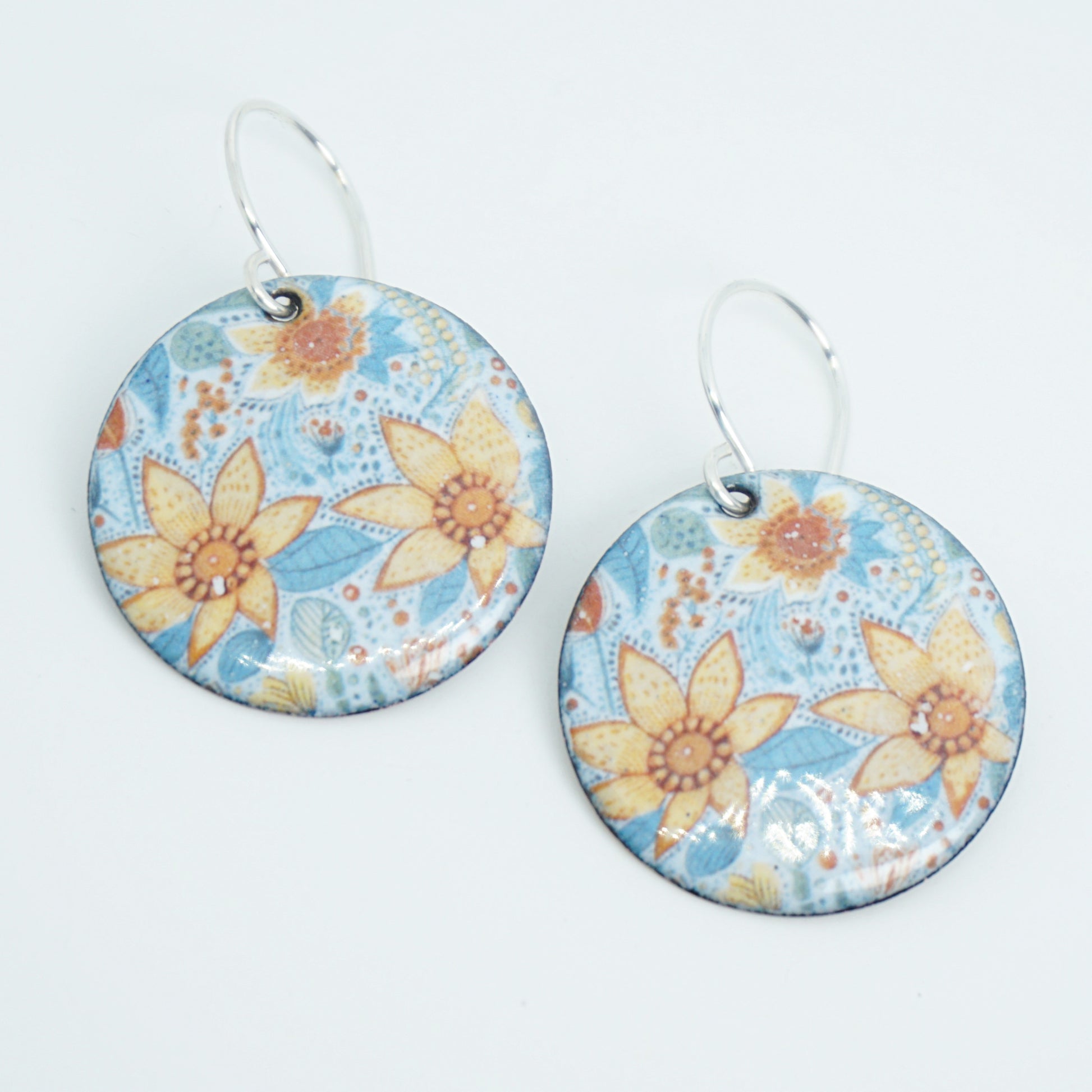 Floral patterned earrings on a white background