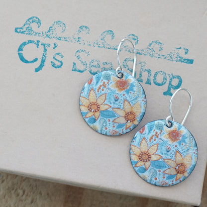 Floral earrings on a gift box