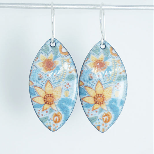 marquis shaped light blue floral patterned earrings on a white background