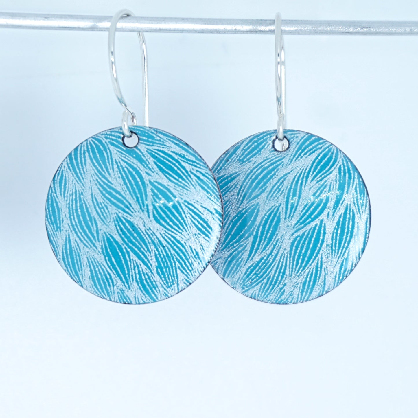 White Leaf Accents on Teal Green Enamel Disc Earrings