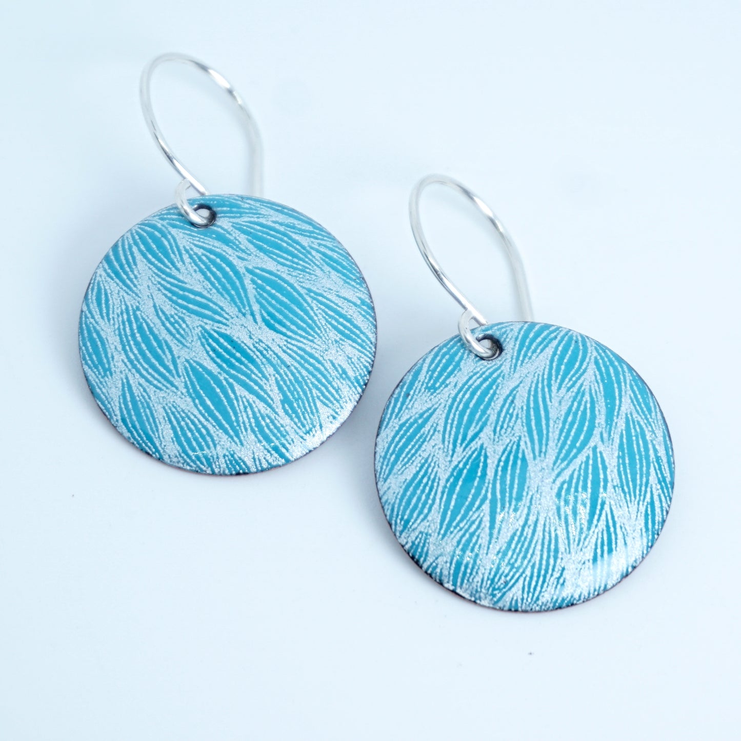 White Leaf Accents on Teal Green Enamel Disc Earrings