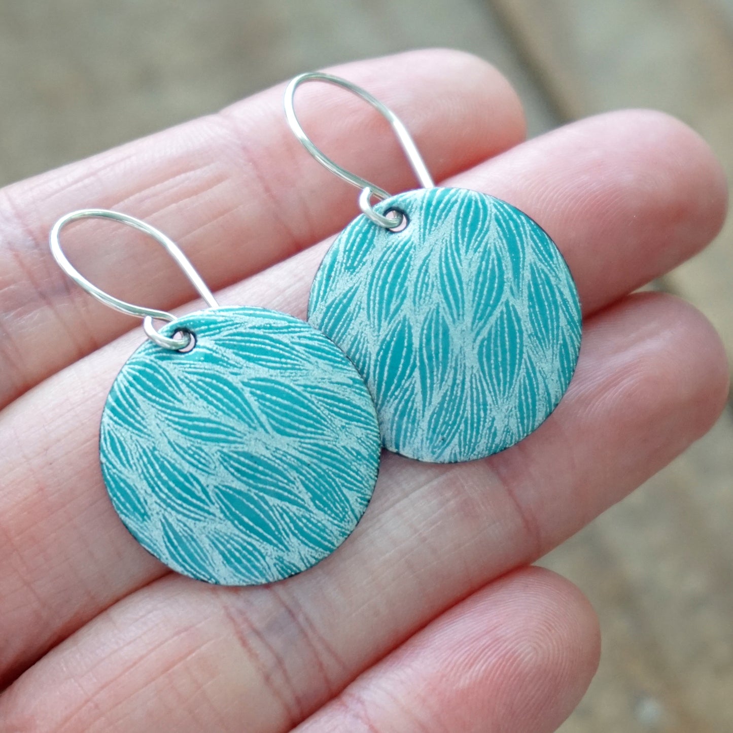 White Leaf Accents on Teal Green Enamel Disc Earrings